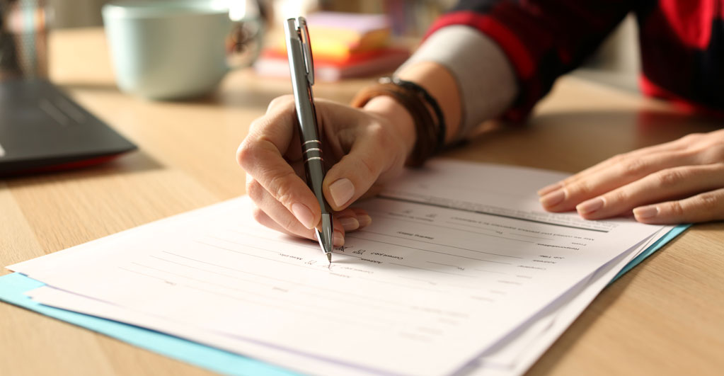 person filling out a State form