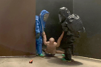 Dummy being pulled out of smoking building