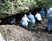 IKC team members inspect the opening as they receive work assignments.