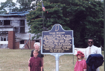 Judy O'Bannon, First Lady of Indiana, and other celebrants at Lyles Station marker dedication, June 24, 2002. Lyles Station school in background.