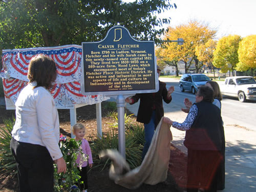 One of Fletcher's descendants unveils the marker.