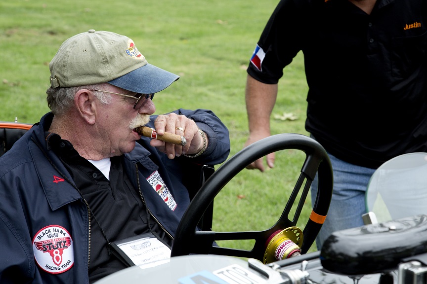 Cigar break in a Stutz racer