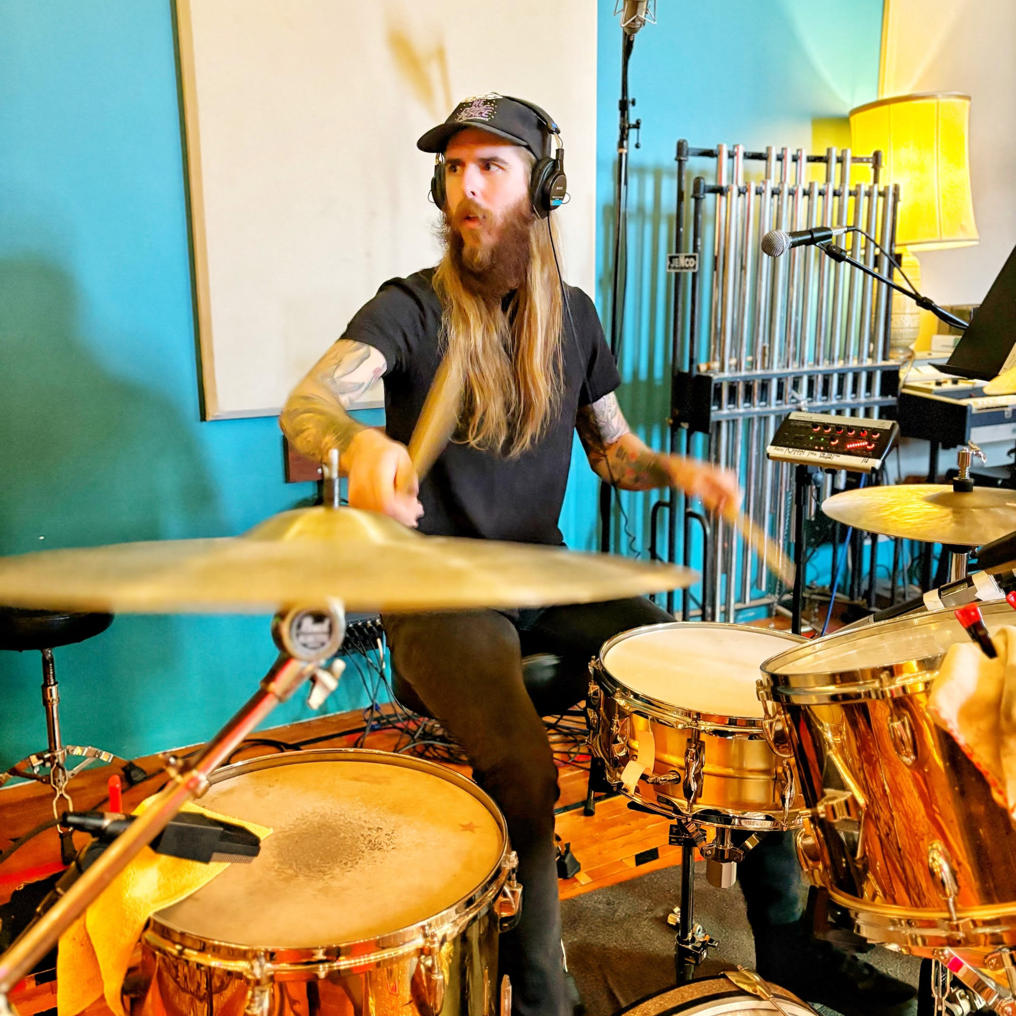 Photo of a man playing the drums