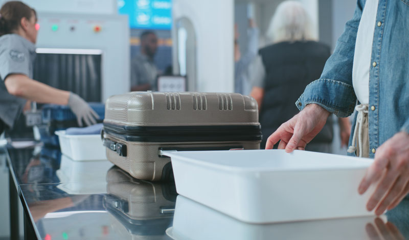 airport passengers in line for security screening