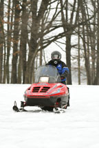 Snowmobile and rider