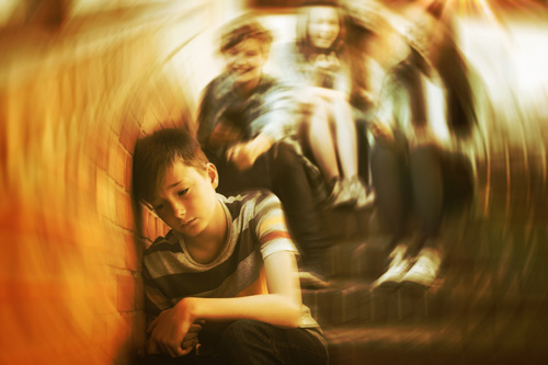 Boy being bullied on stairs and swirl effect simulating emotional state