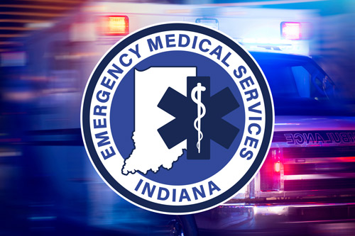 EMS logo over moving ambulance with lights on