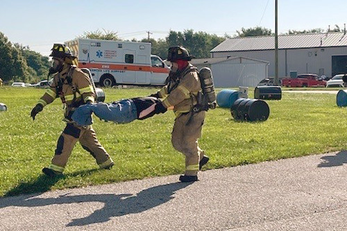 Firefighters carry dummy during Tippecanoe County LEPC drill