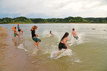 Children frolic at Lieber State Recreation Area’s beach. DNR swimming beaches, pools, and aquatic centers are spread across Indiana, from Lake Michigan to the Ohio River hills. (John Maxwell photo)