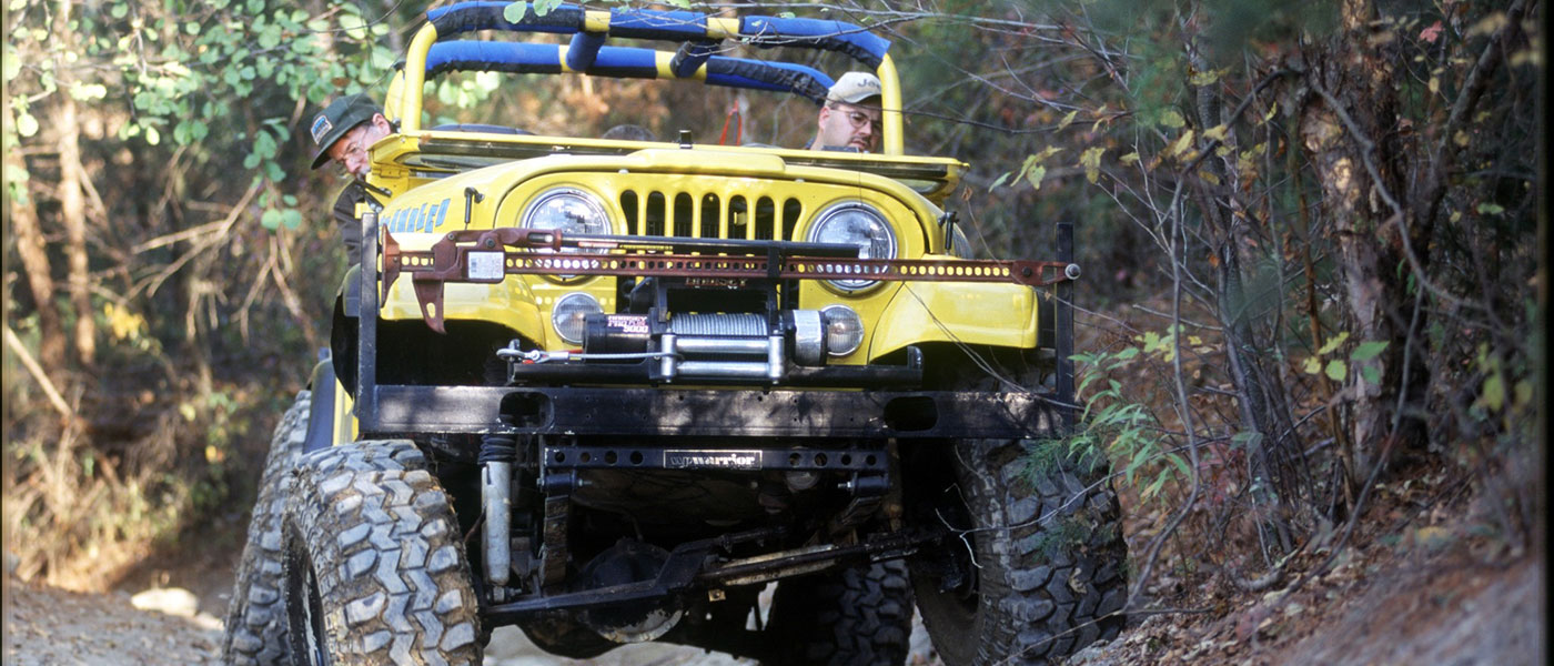 Yellow Jeep in the forest