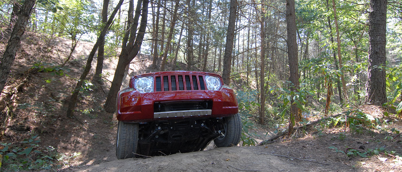 Red Jeep in a forest
