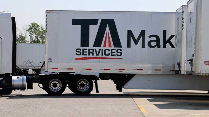 Truck showcasing TA Services logo
