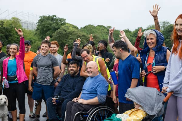 Group of people celebrating outdoors.