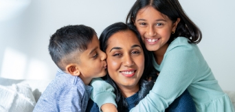 Mother and children hugging